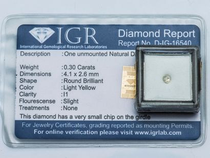 null A round diamond under seal weighing 0.30 carat, Light yellow color, I1 clarity...