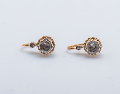 null Pair of 18K yellow gold (750 thousandths) sleepers set with rose-cut diamonds....