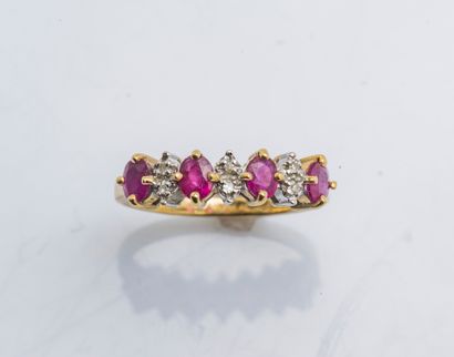 null Ring garter in yellow gold 18 carats (750 thousandths) decorated with oval rubies...