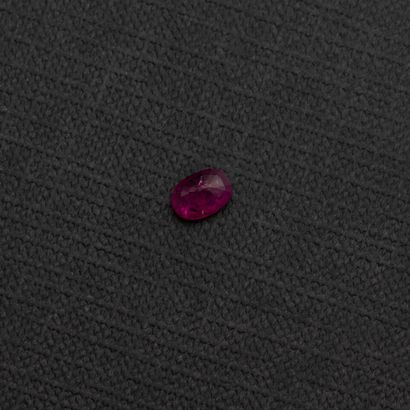 null An oval ruby on paper weighing about 1.