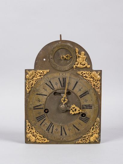 Dial and mechanism of a metal clock decorated...