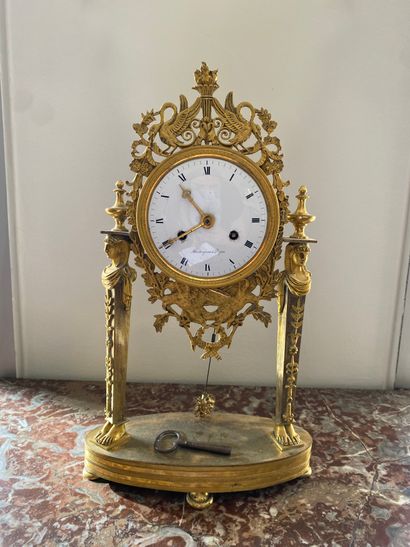 null Gilt bronze clock, the enamelled dial with Roman numerals, signed Maitrejean...