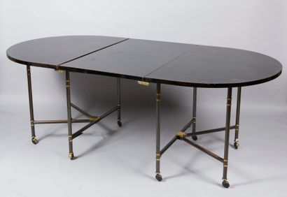 Maison JANSEN JANSEN House

Table model "Royale". Oval top in black lacquer resting...
