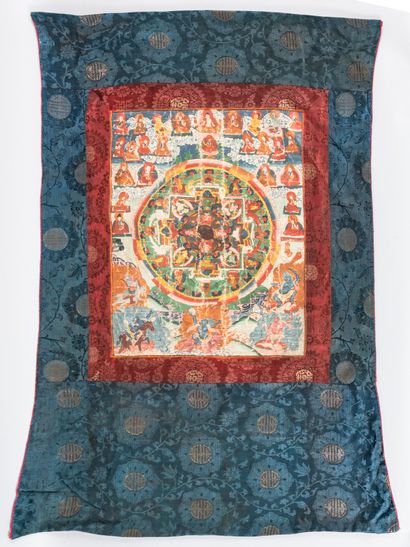 TIBET TIBET 

Silk tanka and gouache paper depicting a Buddhist mandala surrounded...