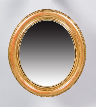 null Miroir œil de sorcière ovale dans un cadre en bois doré 

59 x 51 cm