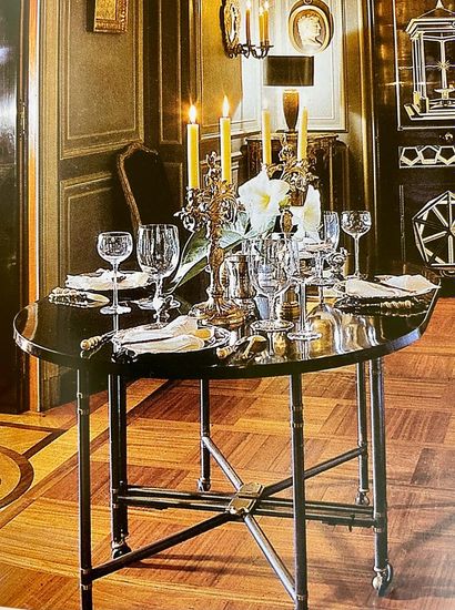 Maison JANSEN JANSEN House

Table model "Royale". Oval top in black lacquer resting...