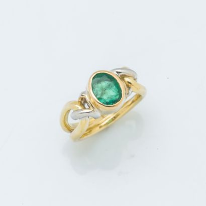 null Yellow gold and 18K (750 ‰) white gold ring adorned with an oval synthetic emerald...