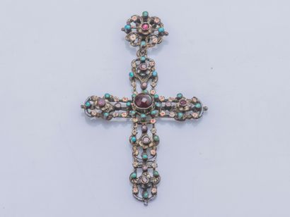 null Pendant cross out of silver (925 thousandths) decorated with a cabochon of garnet,...