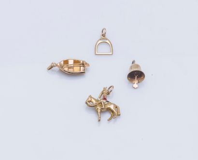 null Lot including 1 18K yellow gold (750 ‰) charm's depicting a two-oar boat, 3...