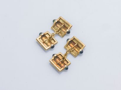 null Pair of 18K yellow gold (750 ‰) cufflinks adorned with black enamel boxes and...