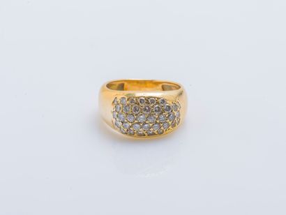 null 18K yellow gold (750 ‰) domed band ring the central oval motif paved with brilliant-cut...
