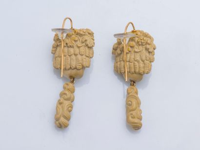 null Pair of ear pendants adorned with carved lava stone Bacchus head and holding...