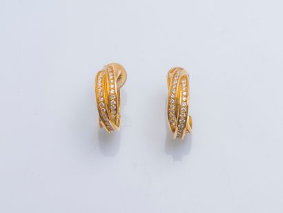 CARTIER Pair of 18K yellow gold (750 ‰) Trinity clip-on hoop earrings formed with...