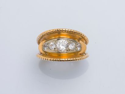 null 18K yellow gold (750 ‰) band ring adorned with five falling white stones, the...