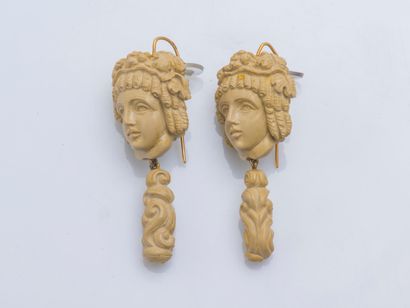 Pair of ear pendants adorned with carved...