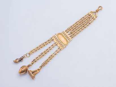 null Chatelaine in 18K yellow gold (750 ‰) formed of chains holding three tassels...