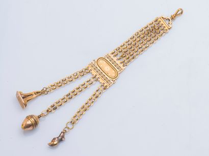 null Chatelaine in 18K yellow gold (750 ‰) formed of chains holding three tassels...