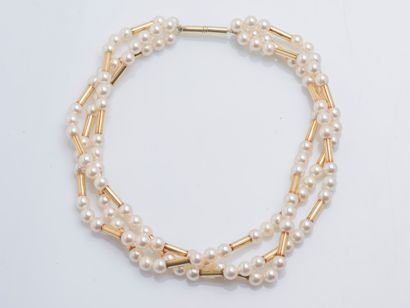 POIRAY circa 2000
Necklace model Roseau composed of three rows of tubes in 18K yellow...