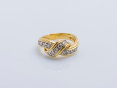 null 18K yellow gold (750 ‰) bow ring set with brilliant-cut diamonds. French work....