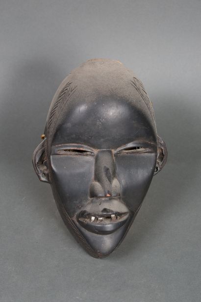 null Masque Dan, Côte d’Ivoire
Bois à patine laquée noire, métal
Années 1920/1930
H....