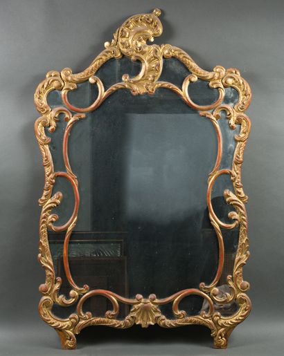 Gilded wood mirror with scroll and rocaille...