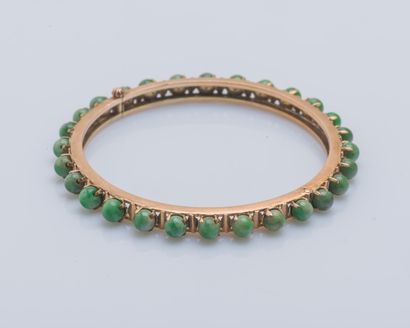 null Bracelet rigide ouvrant en or rose 14 carats (585 ‰) serti de perles de jade...