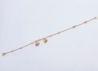 TTF Bracelet chaîne en or jaune 18 carats (750 ‰) orné de quatre diamants taillés...