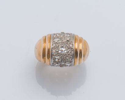 null 18K yellow gold (750 ‰) and platinum (950 ‰) dome ring adorned with a band of...