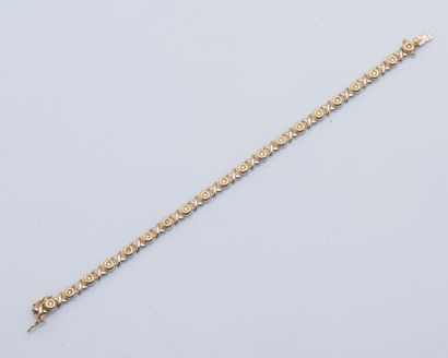 null Bracelet gourmette en or jaune et or gris 18 carats (750 ‰) orné de diamants...
