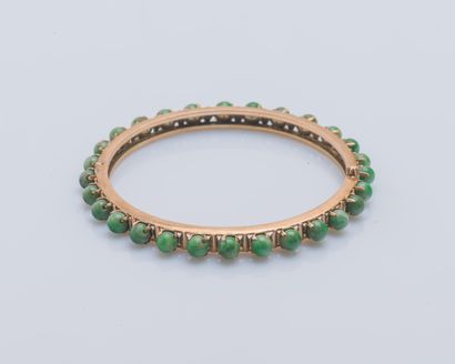 null Rigid opening bracelet in 14K rose gold (585 ‰) set with jade beads all around....