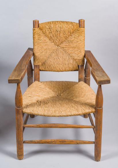 null Pierre JEANNERET (1896-1967)
Pair of oak and straw "paillés" armchairs, model...