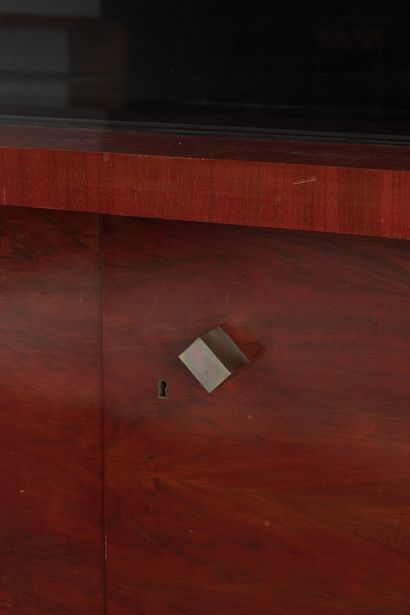null Red mahogany veneered sideboard opening on the lower part with three leaves...