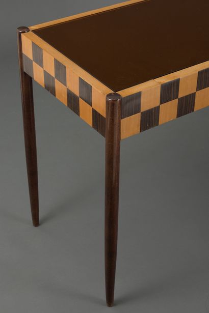 null Inlaid wood console with checkerboard pattern, orange mirror top, resting on...