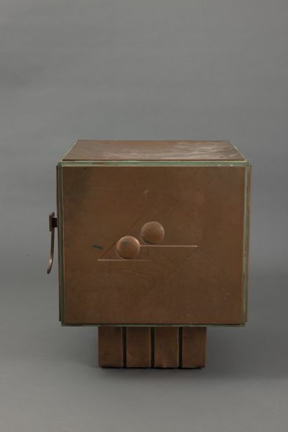 null Modernist cube-shaped piece of furniture in hammered copper, decorated on all...