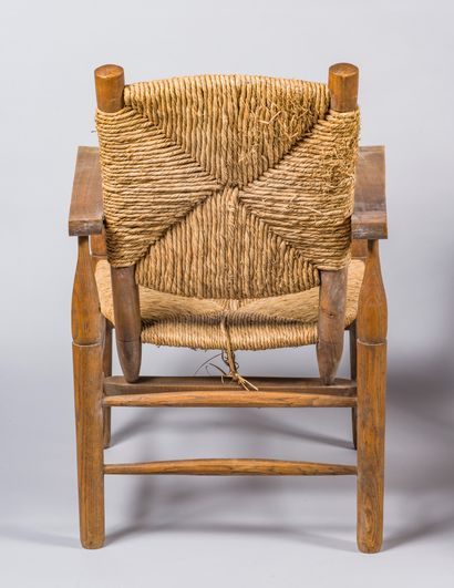 null Pierre JEANNERET (1896-1967)
Pair of oak and straw "paillés" armchairs, model...