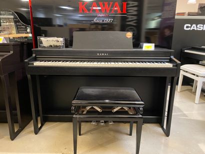 null 1 piano droit numérique KAWAI noir mat CN-201
83 x 136 cm 
On y joint un ta...