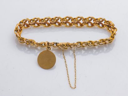 null Bracelet gourmette yellow gold 18 carats (750 thousandths) with fancy mesh decorated...