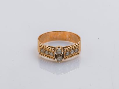 null Ring band in pink gold 18 carats (750 thousandths) set with seed pearls. French...