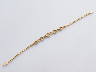 null Bracelet en or jaune et or gris 18 carats (750 millièmes) et platine (850) formant...