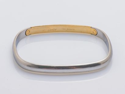 CARTIER Bracelet jonc de section carrée en acier et or jaune 18 carats (750 millièmes)....