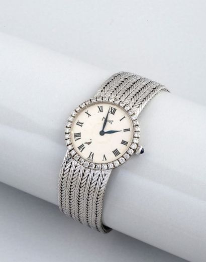 PIAGET (LADY OR GRIS DIAMANTS) vers 1960
Bracelet montre de dame en or gris 18 carats...