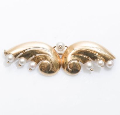 null Broche formant des ailes stylisées en or jaune 18 carats (750 millièmes) sertie...
