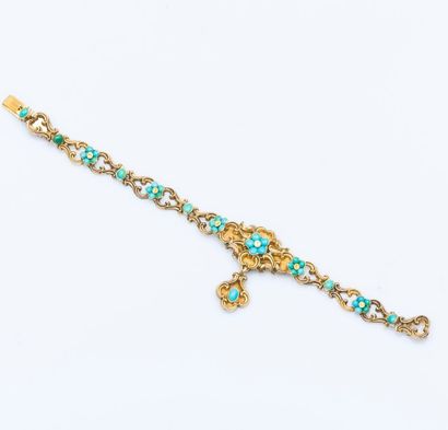 null Bracelet en or jaune 9 carats (375 millièmes) composé de motifs d'arabesques...