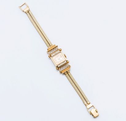 null Bracelet montre de dame en or jaune 18 carats (750 millièmes), le boîtier rectangulaire...