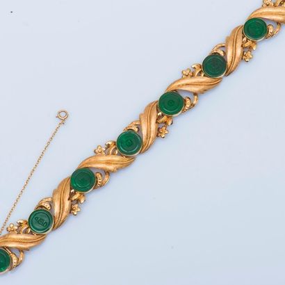 null Bracelet ruban articulé en or jaune 14 carats (585 millièmes) à décor de plaques...