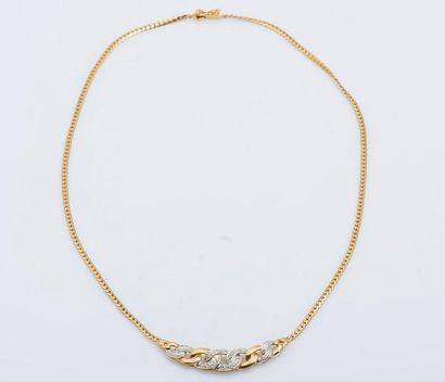 null Collier en or jaune 18 carats (750 millièmes) formé d’une chaîne retenant un...