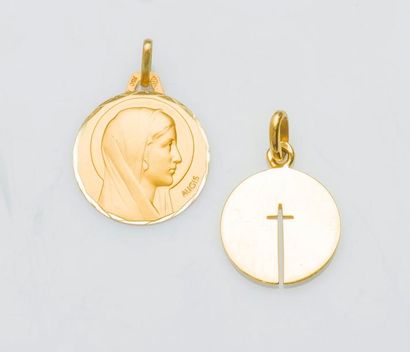null Médaille en or jaune 18 carats (750 millièmes) ornée du profil de la Vierge.

Diam...