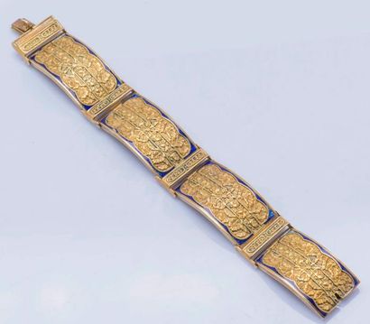 null Bracelet articulé en or jaune 14 carats (585 millièmes) à décor ciselé de nœuds...