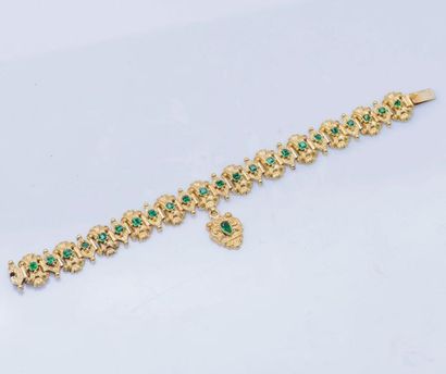 null Bracelet articulé en or jaune 18 carats (750 millièmes), les maillons ciselés...