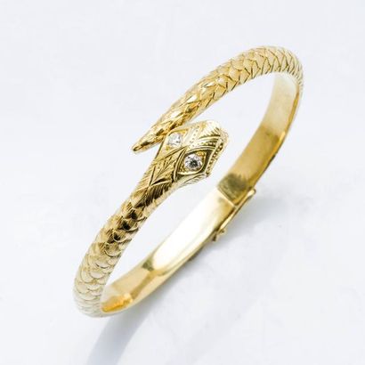 null Bracelet serpent en or jaune 14 carats (585 millièmes) formant un jonc ouvrant,...